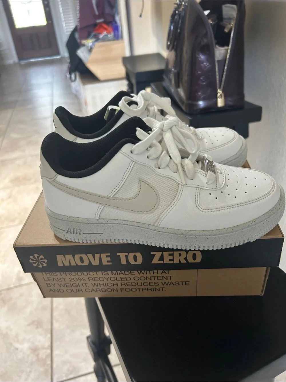 Nike Kids White Sneakers with Black Collar and Cream Swoosh 4.5
